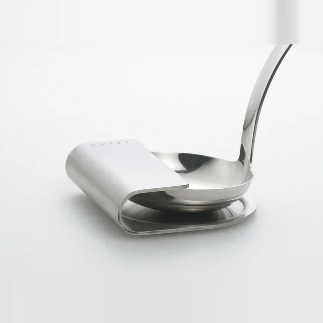 Oki stainless ladle rest holding a ladle