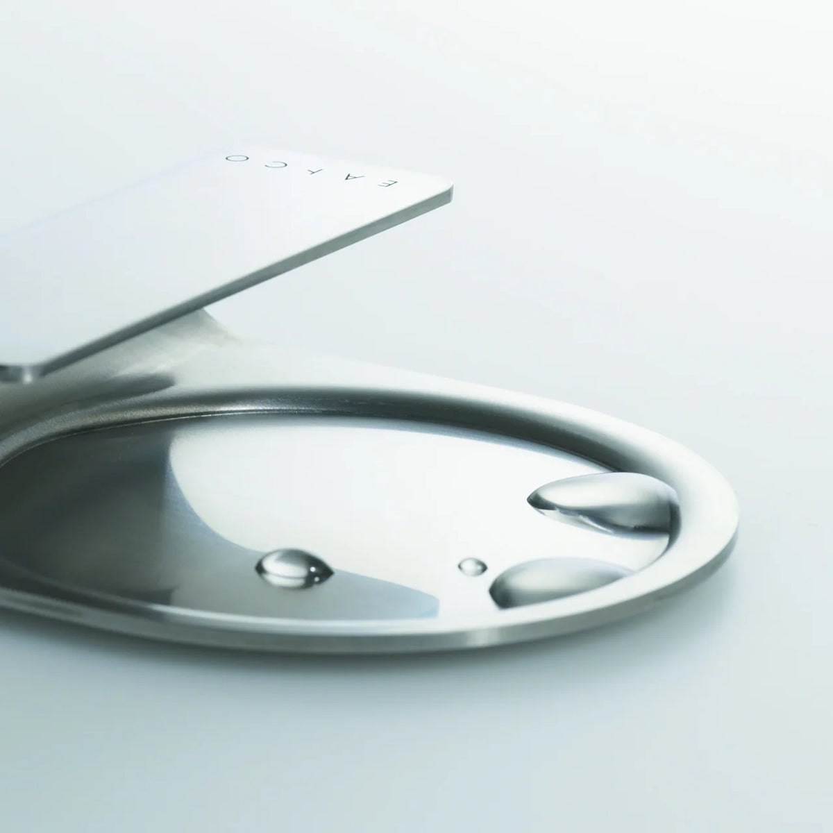 Oki ladle rest on a stainless pot lid