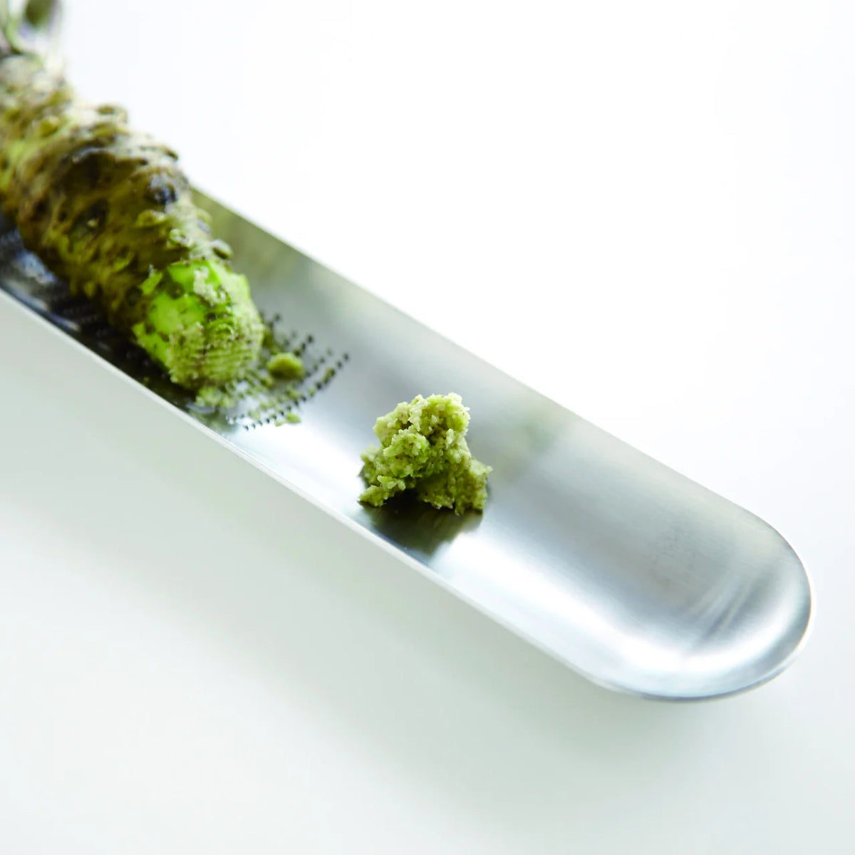 Oros M grater with grated wasabi and a wasabi root