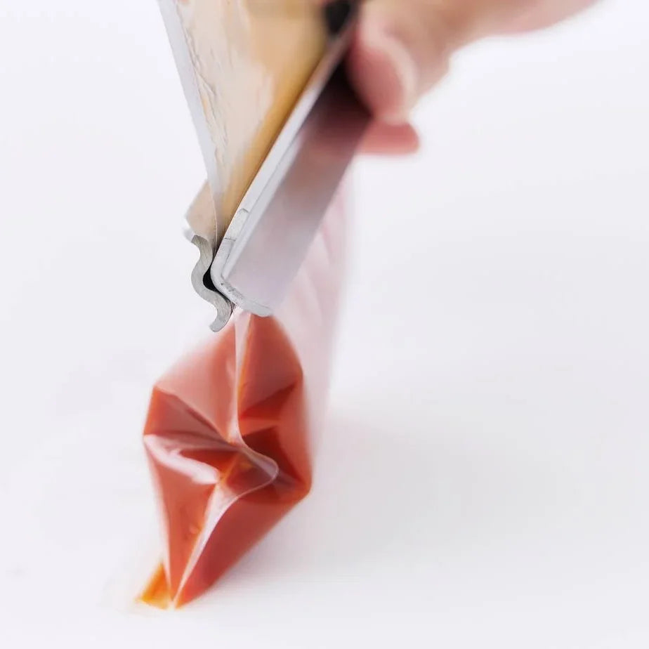 Squeezing sauce from a pouch with Shiboru