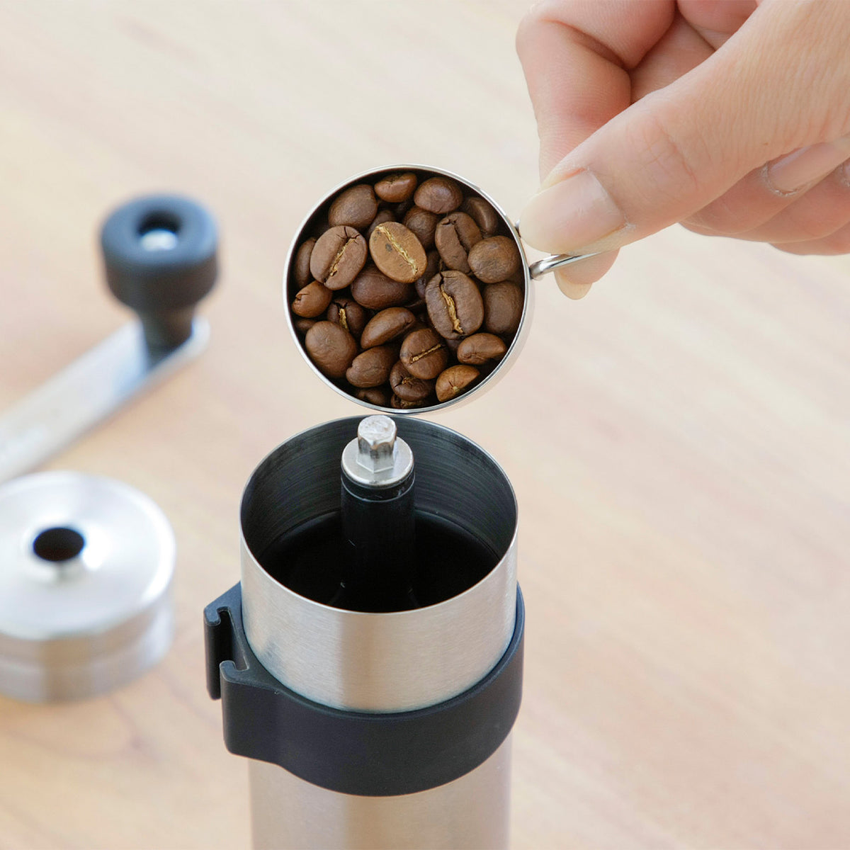 Adding coffee beans to the Powder Control Mill