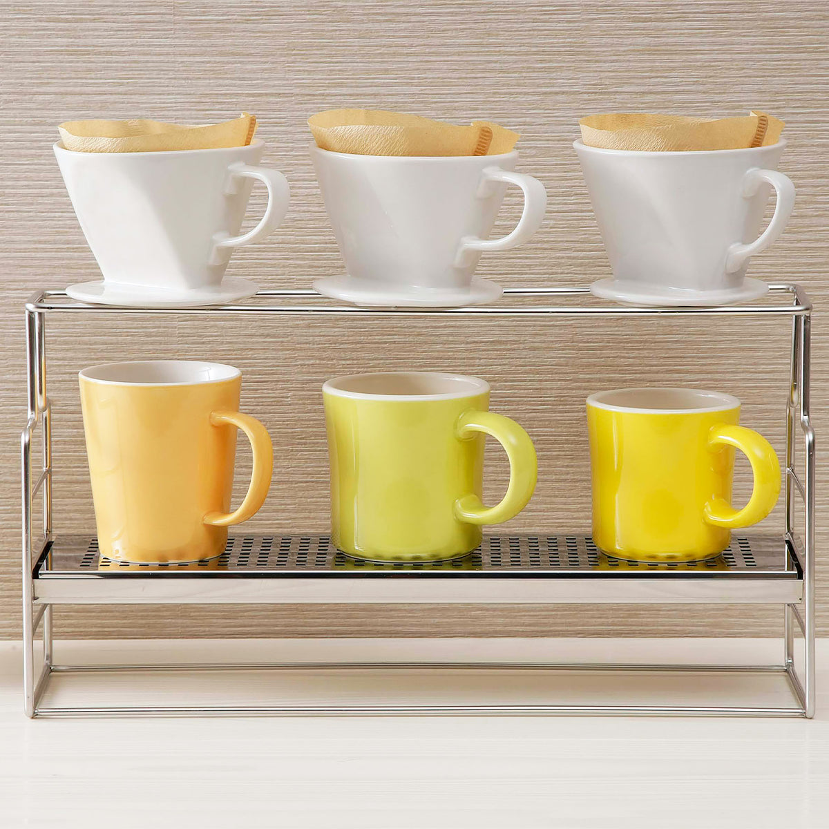 Three drippers over colorful mugs on the stand