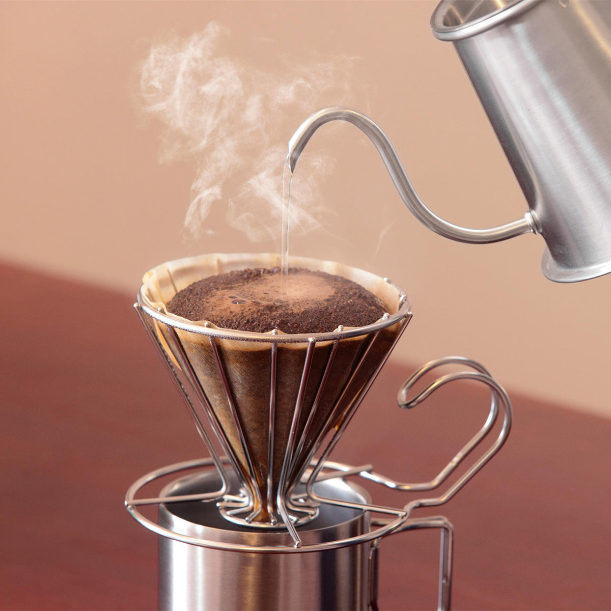 Steaming pour-over coffee in the wire dripper