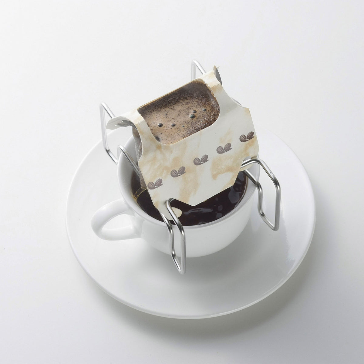 Drip bag stand on a cup and saucer