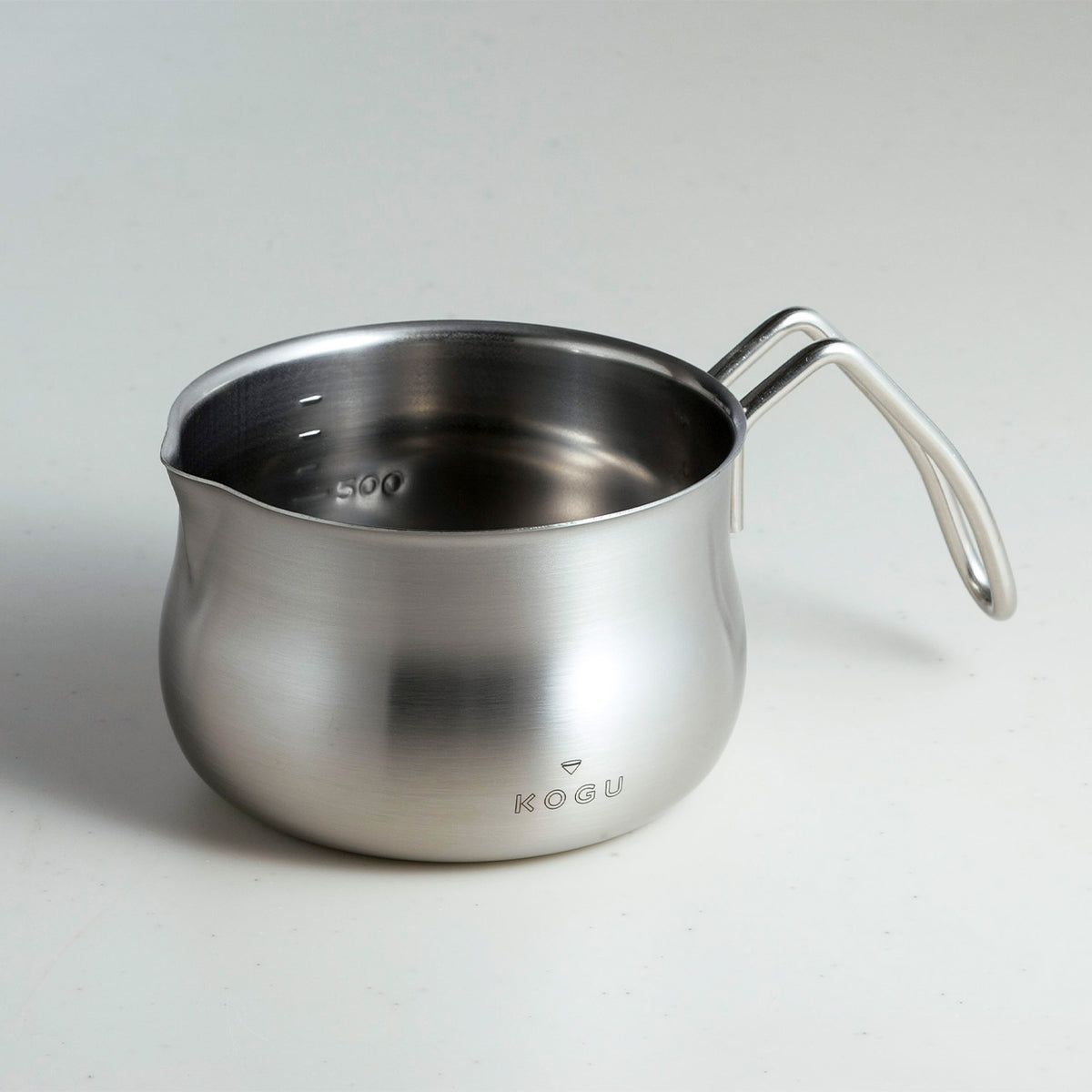 Rounded 1L stainless steel milk pan, side view