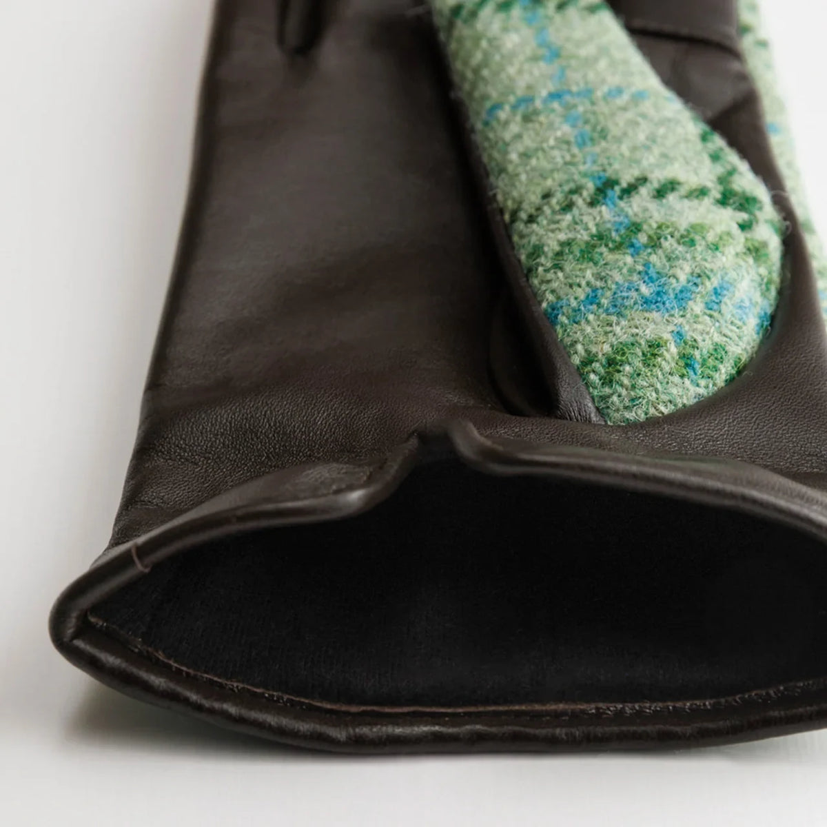 Kuroda women’s Harris Tweed gloves held in hand