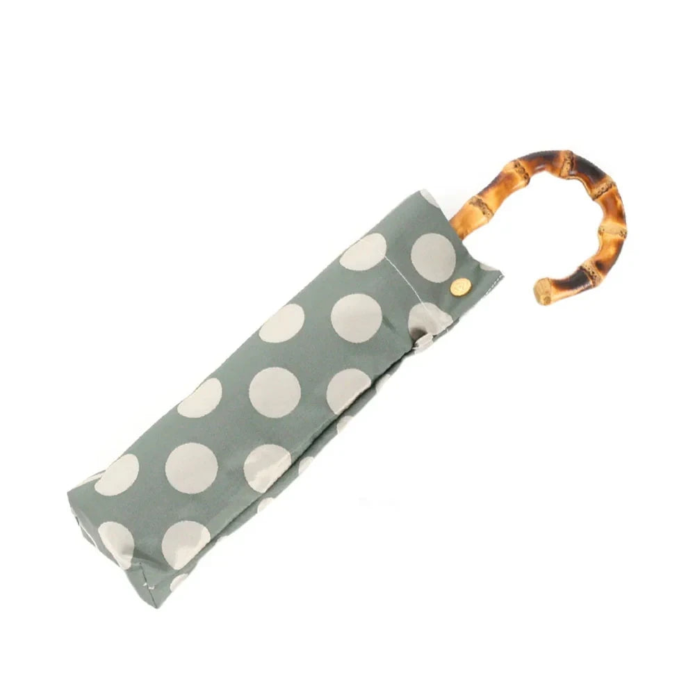 kirie Dots and Stripes folding umbrella in Forest Green, folded #Color_Forest Green