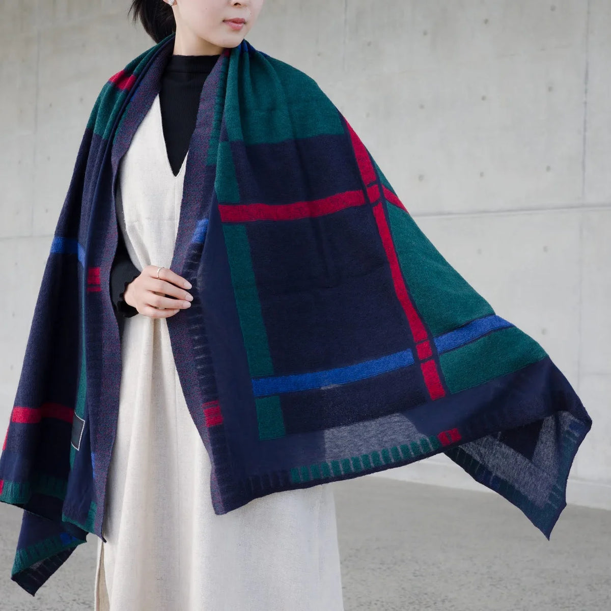Navy tanbo stole worn over a coat