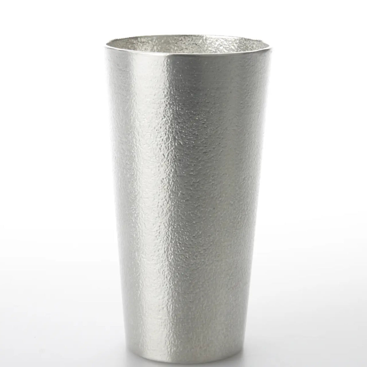 Single tin beer cup with a fine hammered texture on white