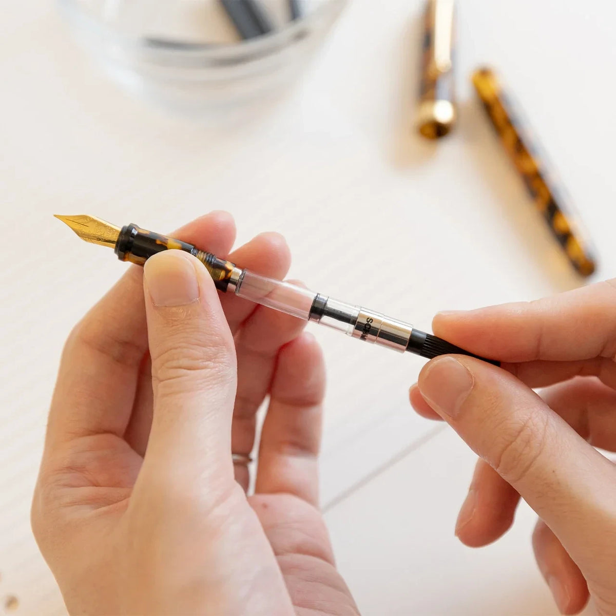 Filling the acrylic fountain pen with a converter