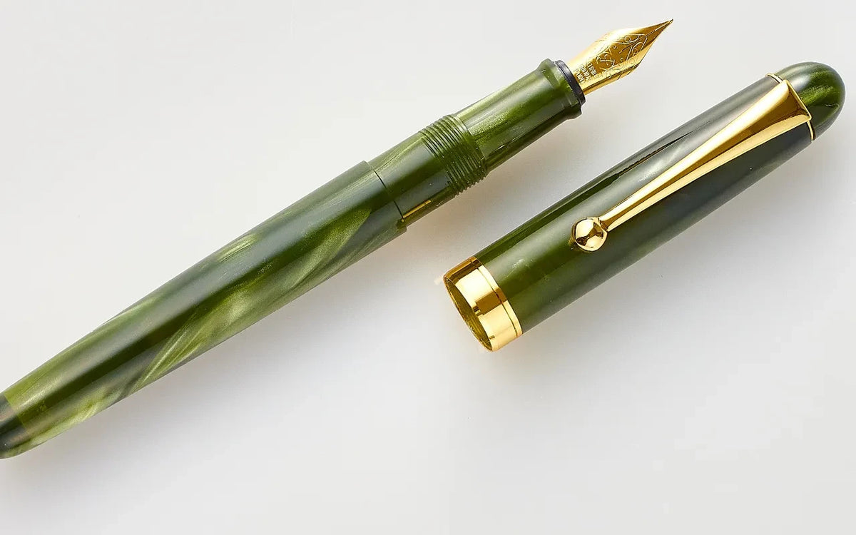 Close-up of the green marbled acrylic barrel and cap