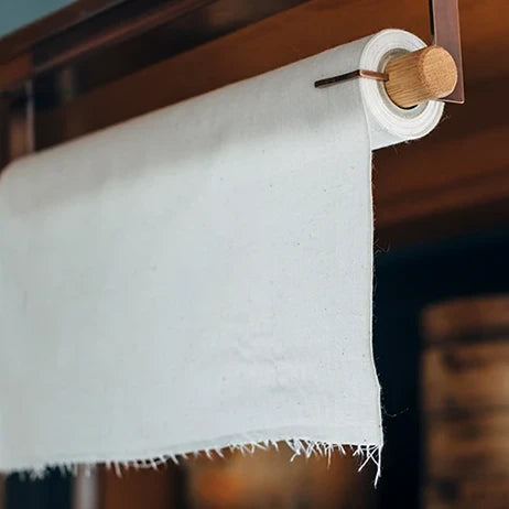 sasasa roll holder hanging under a kitchen shelf