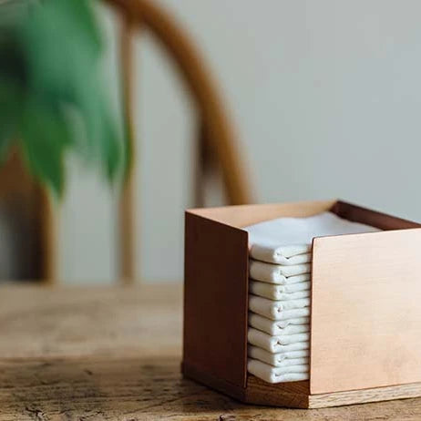 sasasa oak stocker with wazarashi squares on a table