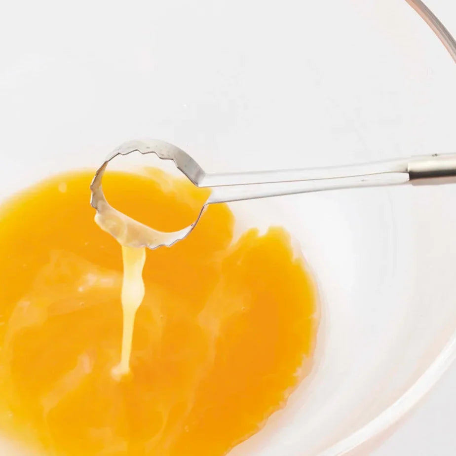Toku egg beater lifting beaten egg
