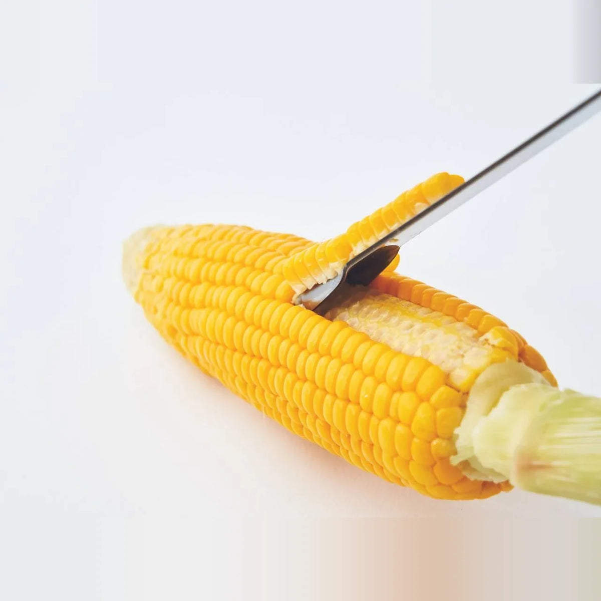 Poro peeler removing a row of corn kernels