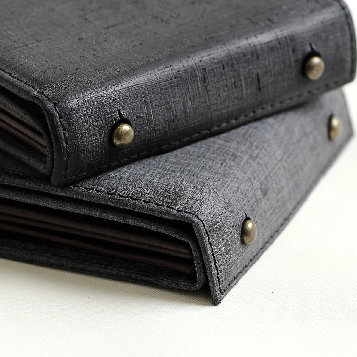 Grid-scratched texture of m+ Quadretti leather