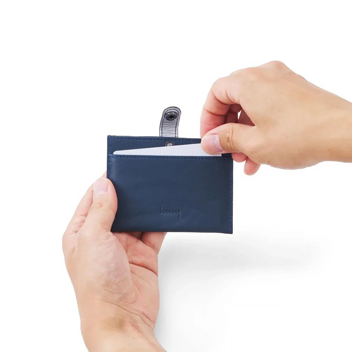 Inserting a card into the hmny ID card holder