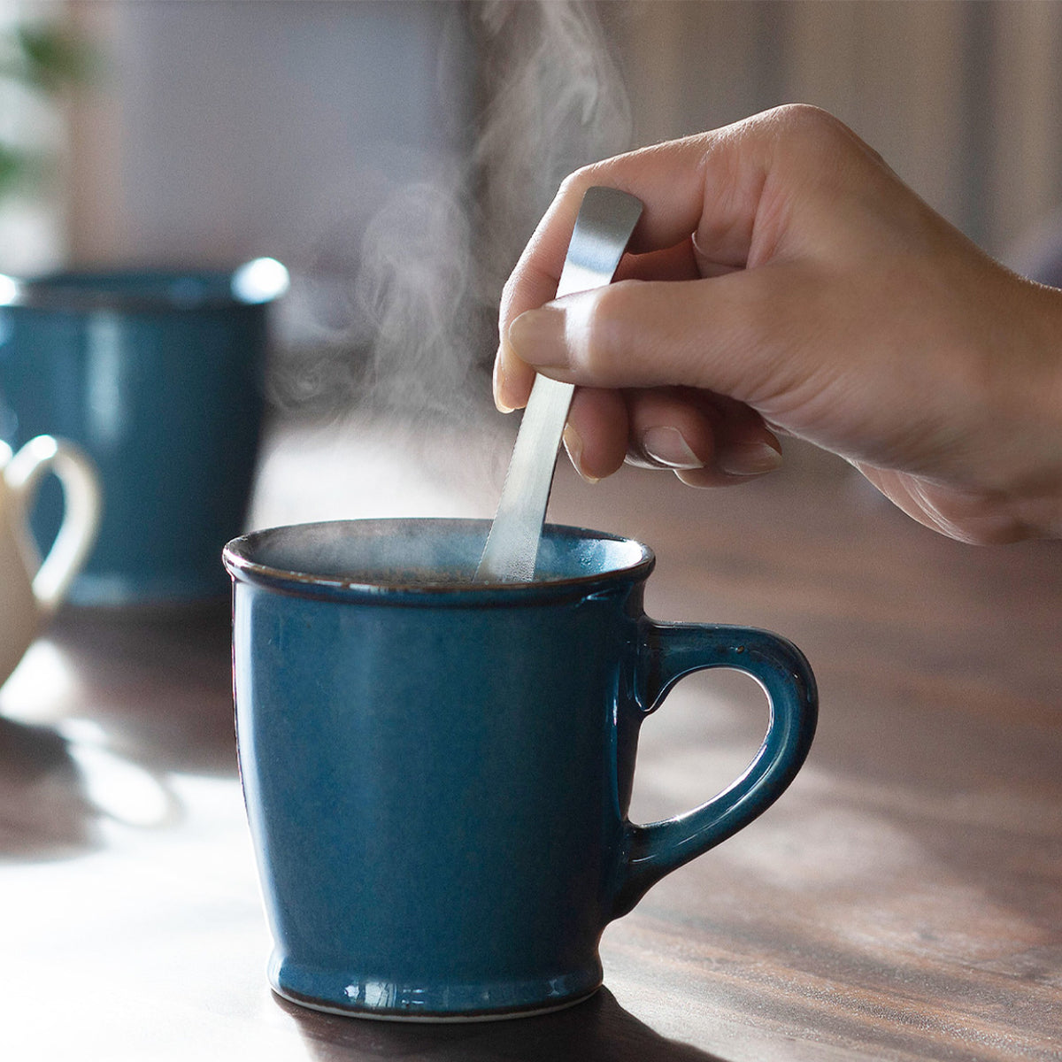 Stirring a mug with the longer mug spoon