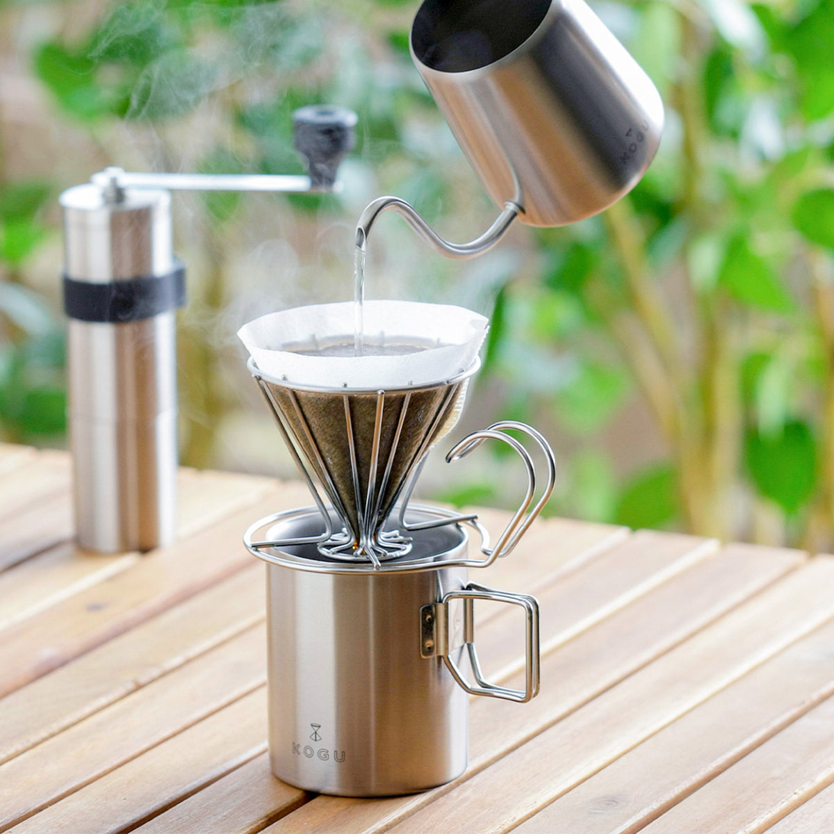 Brewing coffee directly into the mug with a wire dripper outdoors