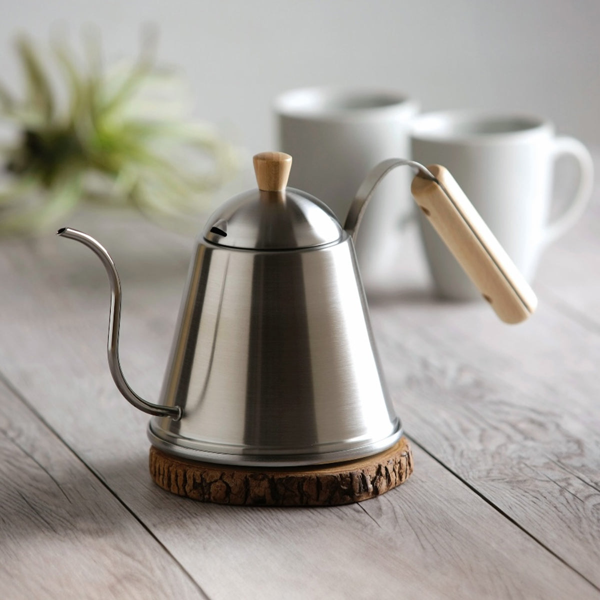 ITTEKI drip pot with wooden handle on a wooden stand