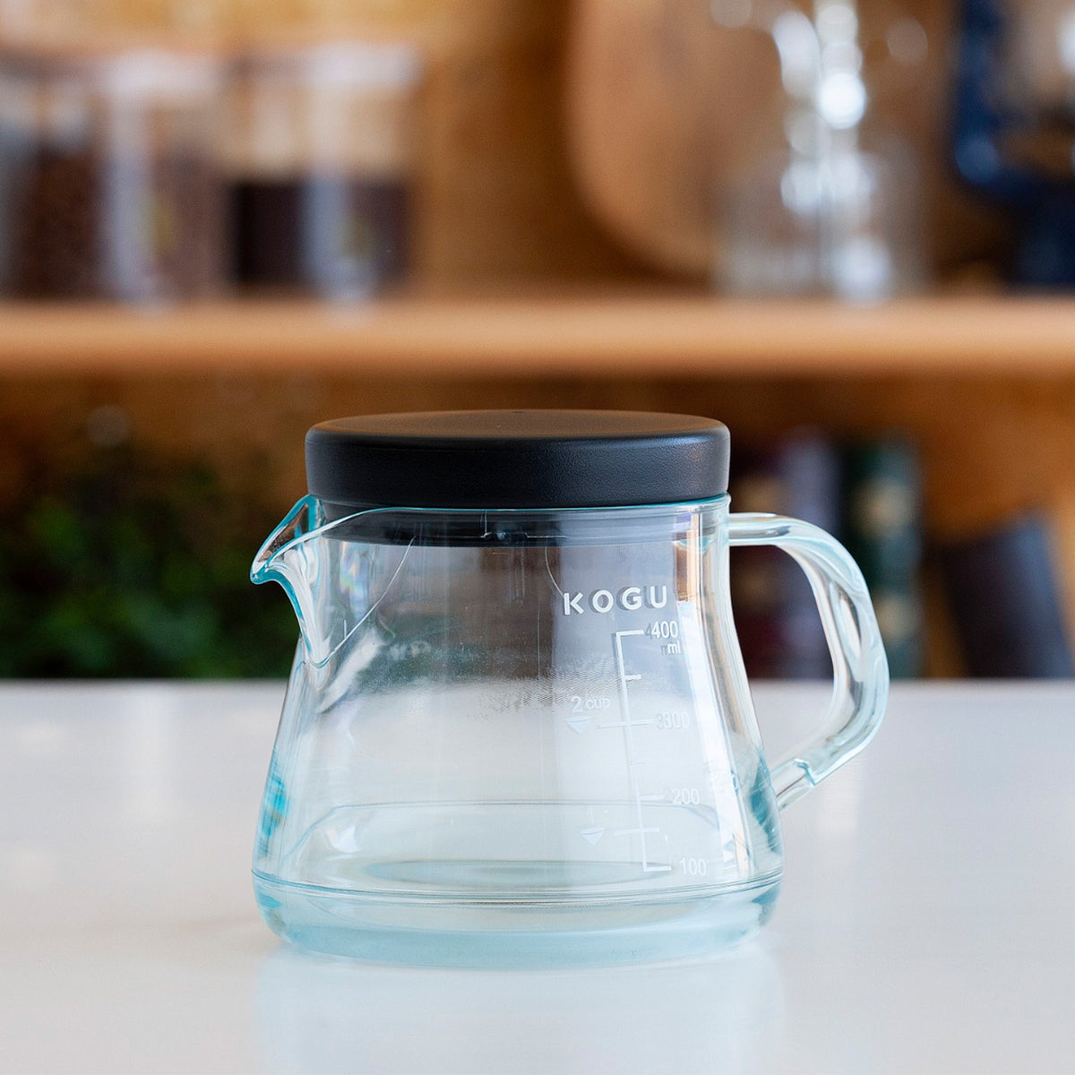 Clear coffee server on a kitchen counter