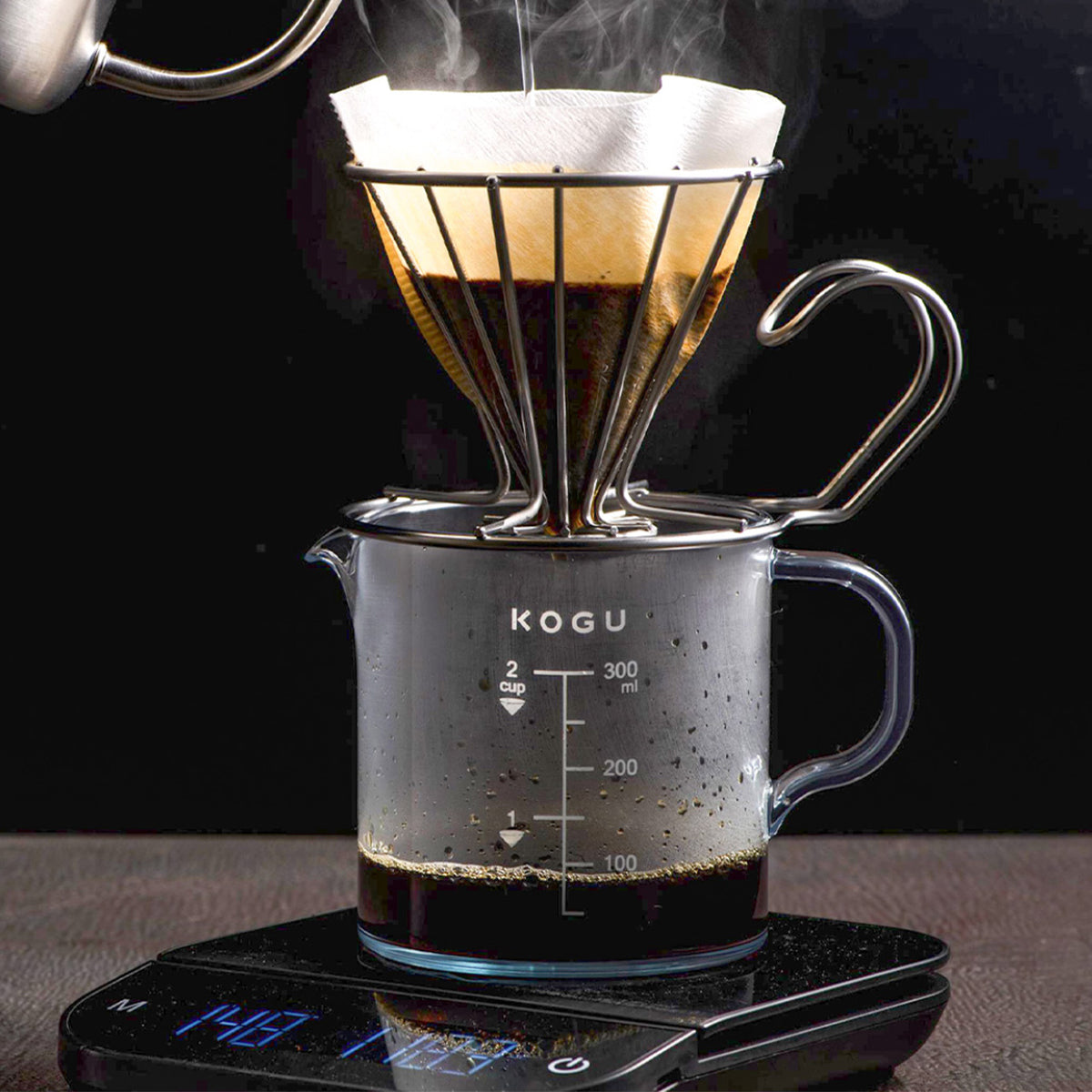 Brewing pour-over into the coffee server on a scale