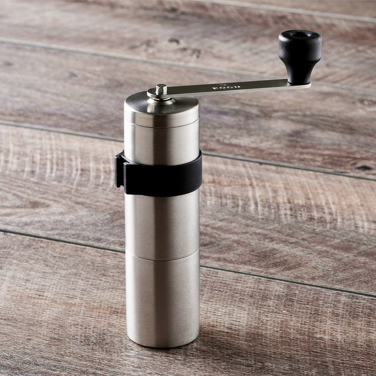 Powder Control coffee mill on a wooden table