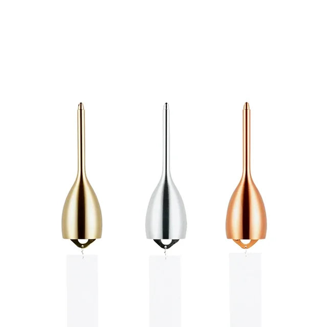 Three Slim brass wind chimes side by side in gold, silver and pink gold