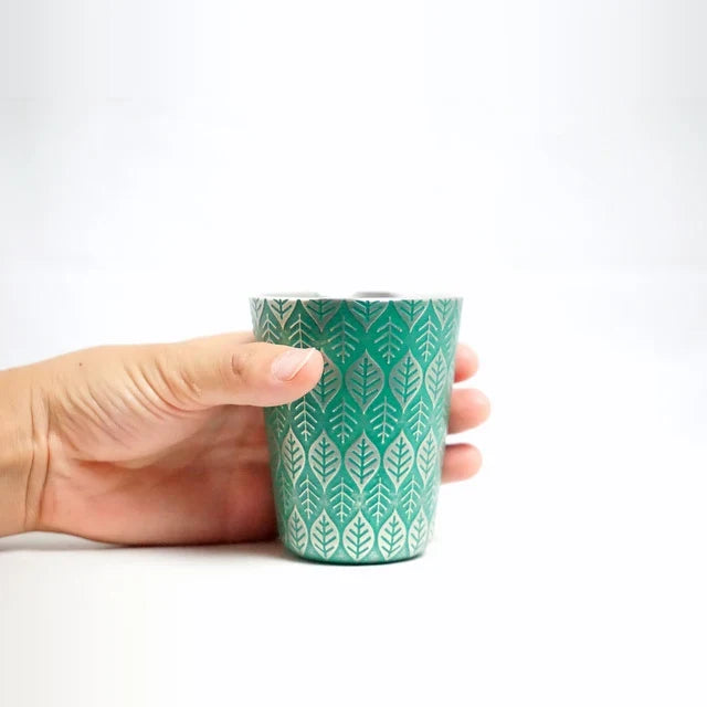 Holding the Happa tin tumbler in one hand