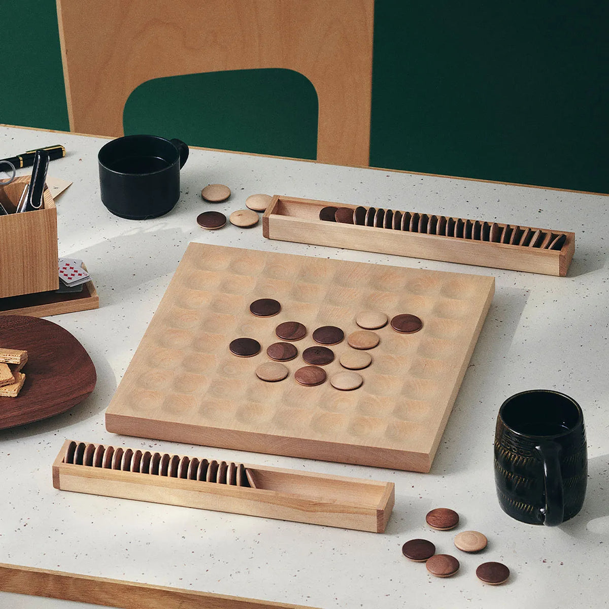 Wooden reversi set on a table during a game